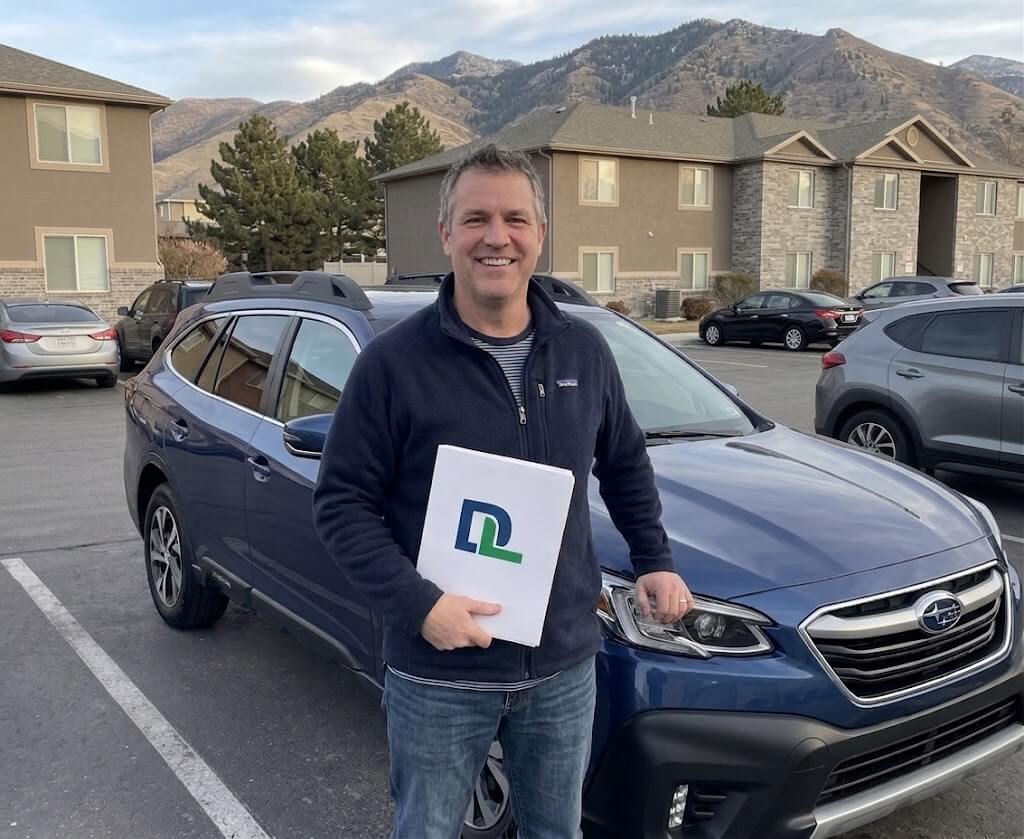Driver with their new vehicle