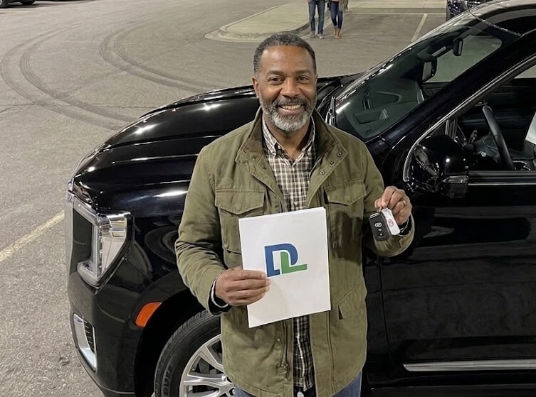 Driver with their new vehicle